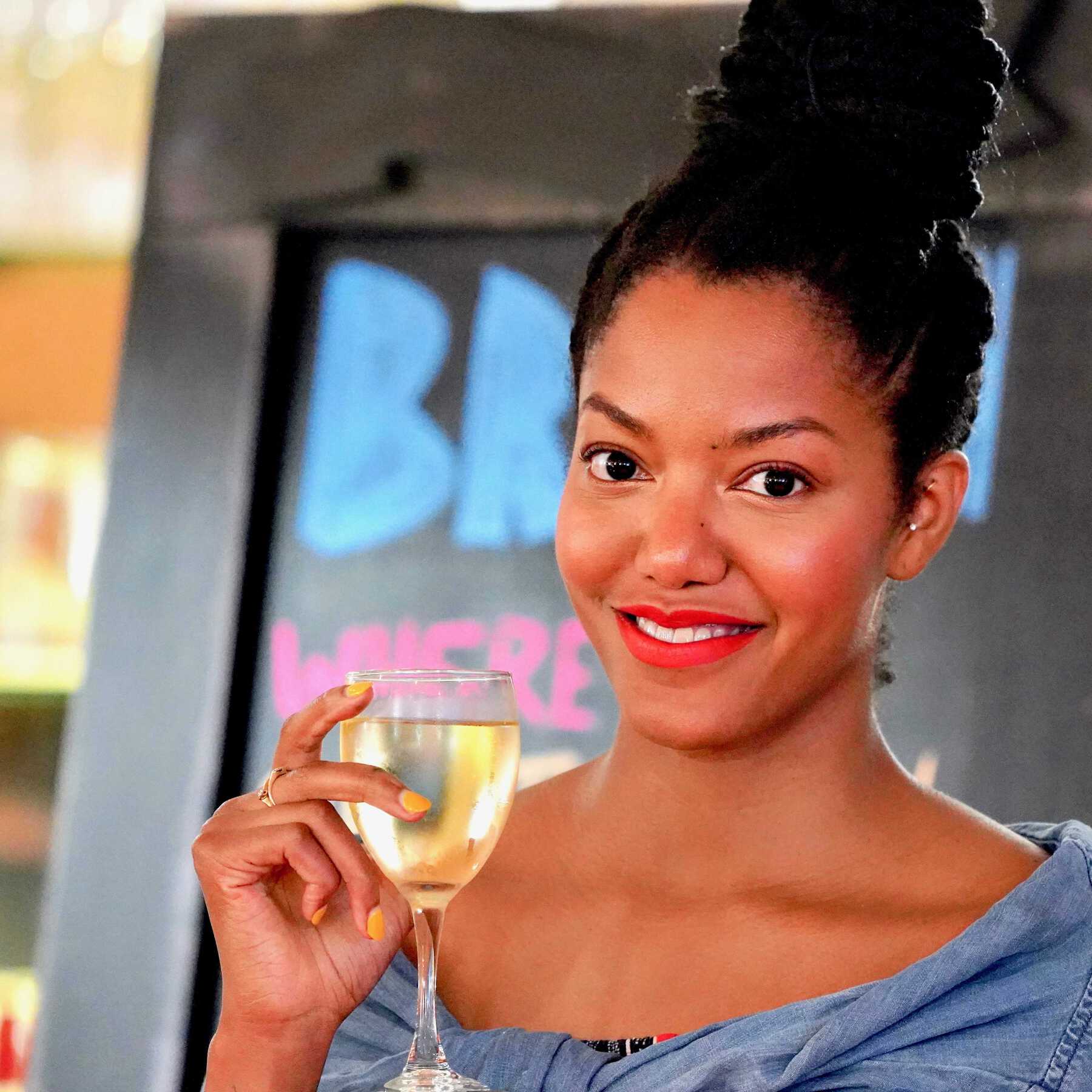 Woman smiling with wine glass