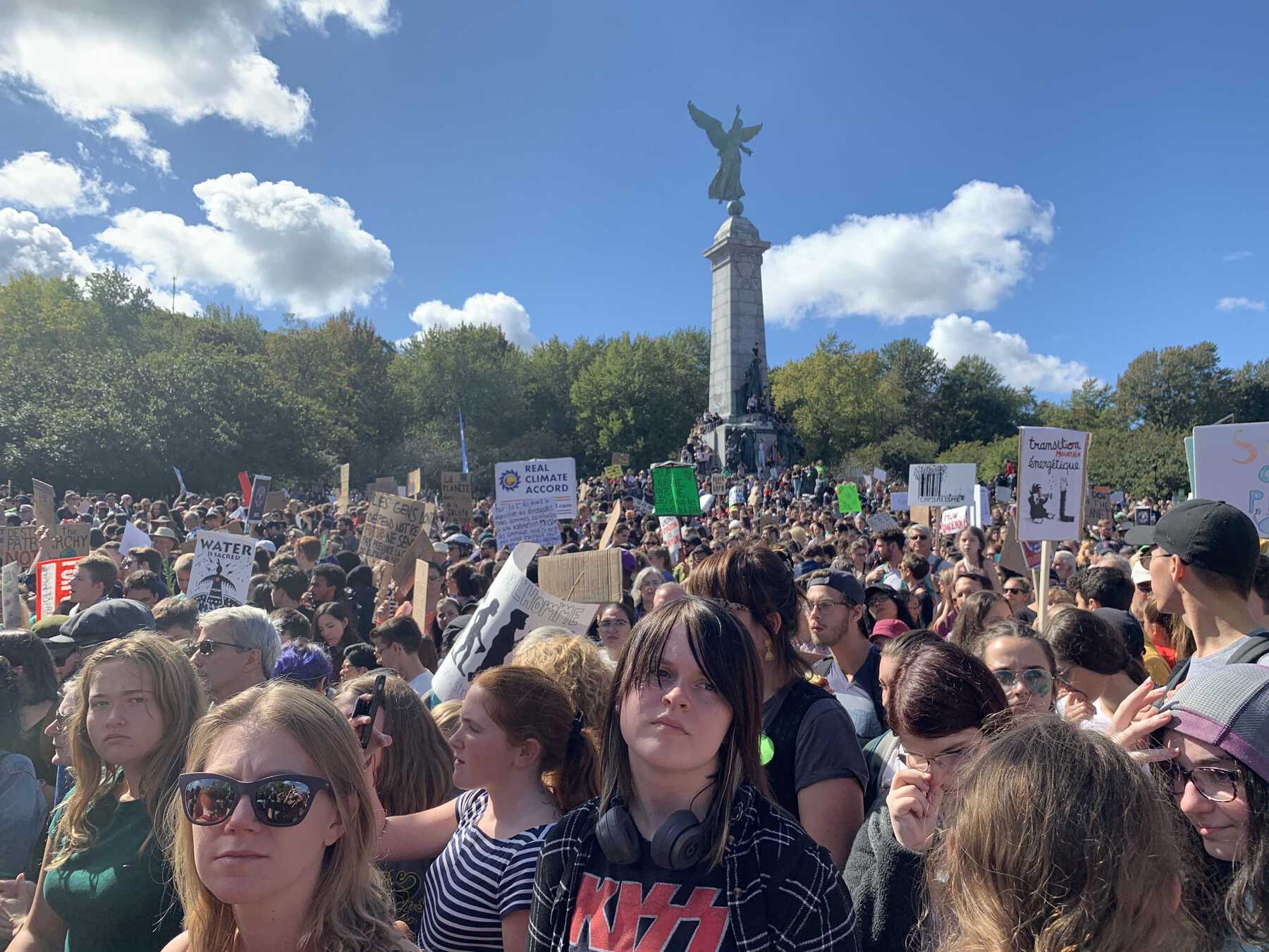 Crowd of protestors in front of monument