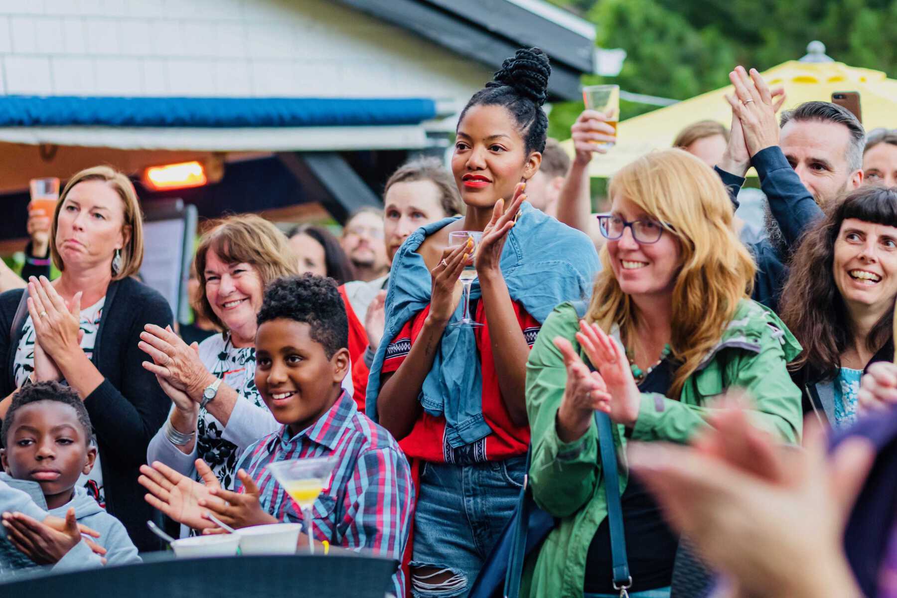 Group of people smiling and clapping