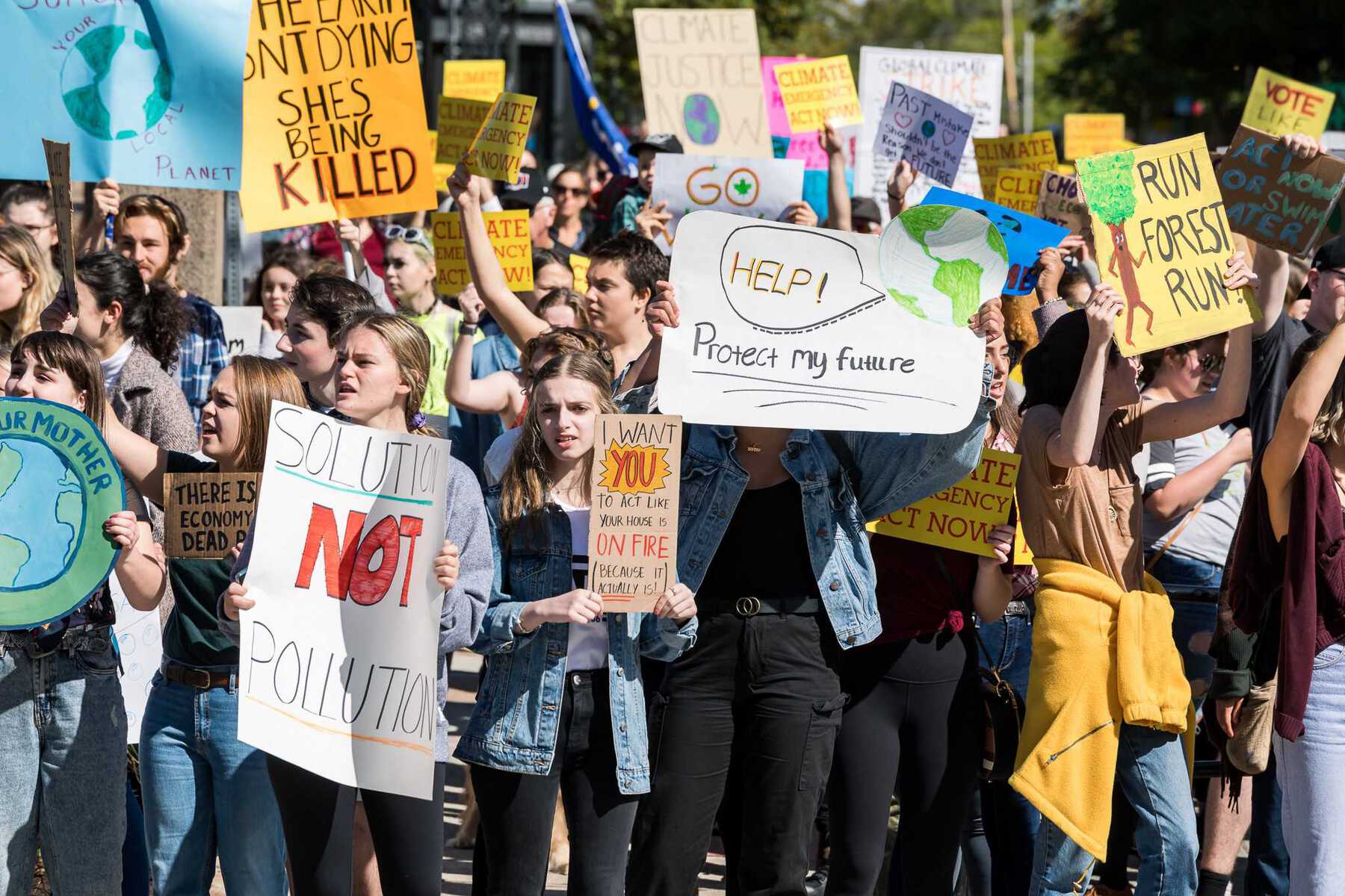 Crowd of young protesters with signs