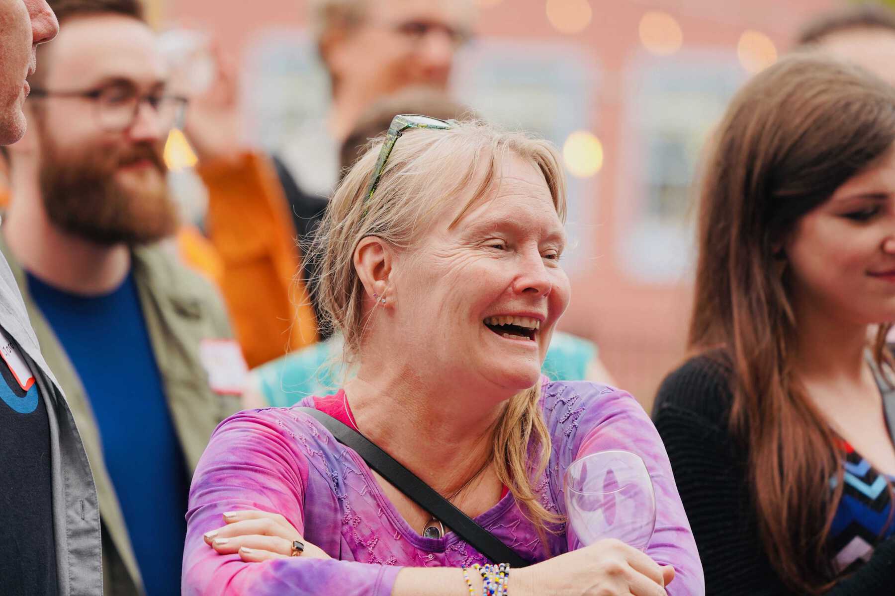 Woman smiling in crowd