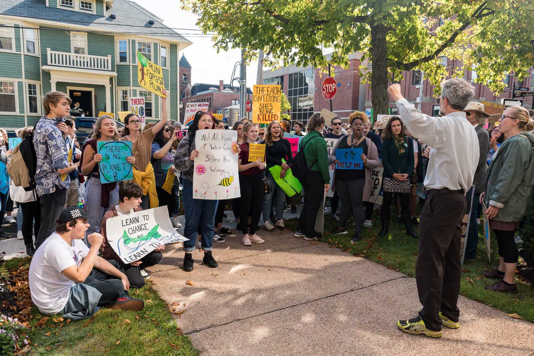 Man speaking to crowd of protesters