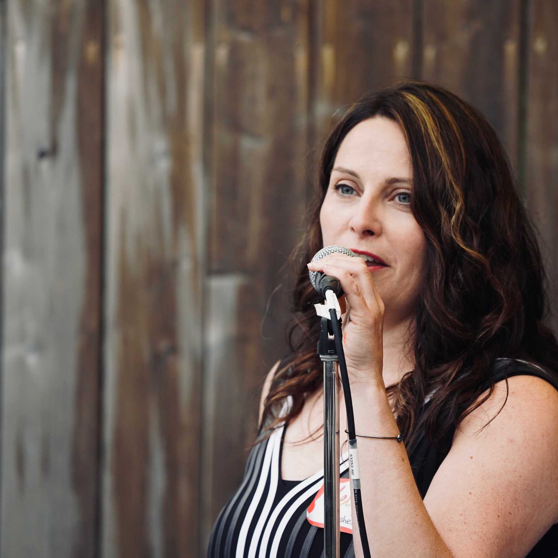 Woman speaking at microphone