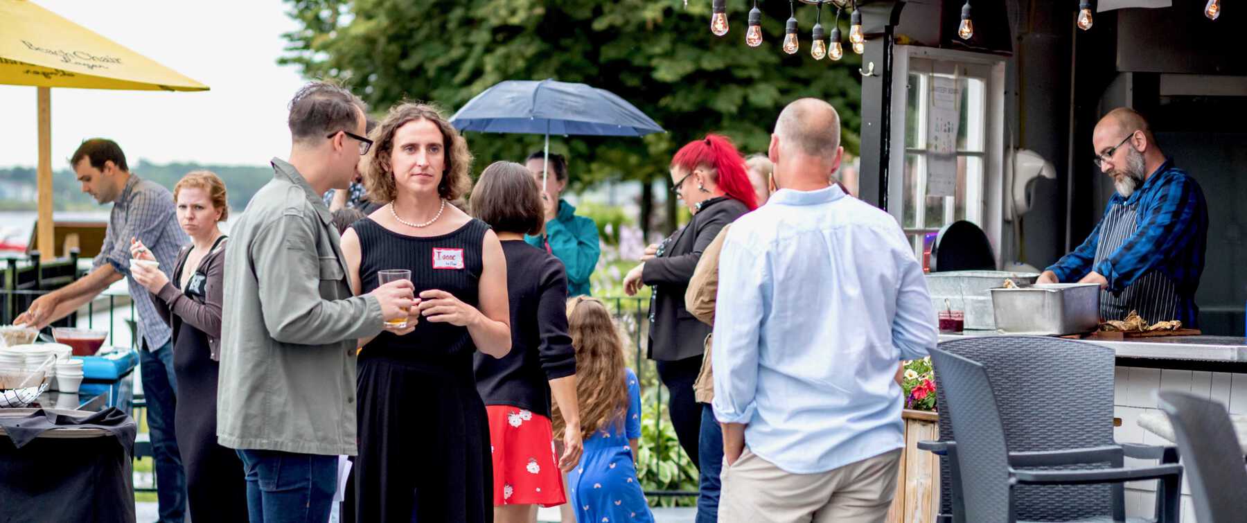 Crowd speaking outdoors