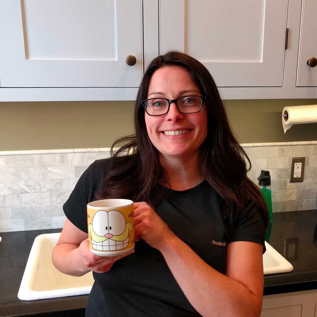 Woman smiling with Garfield mug