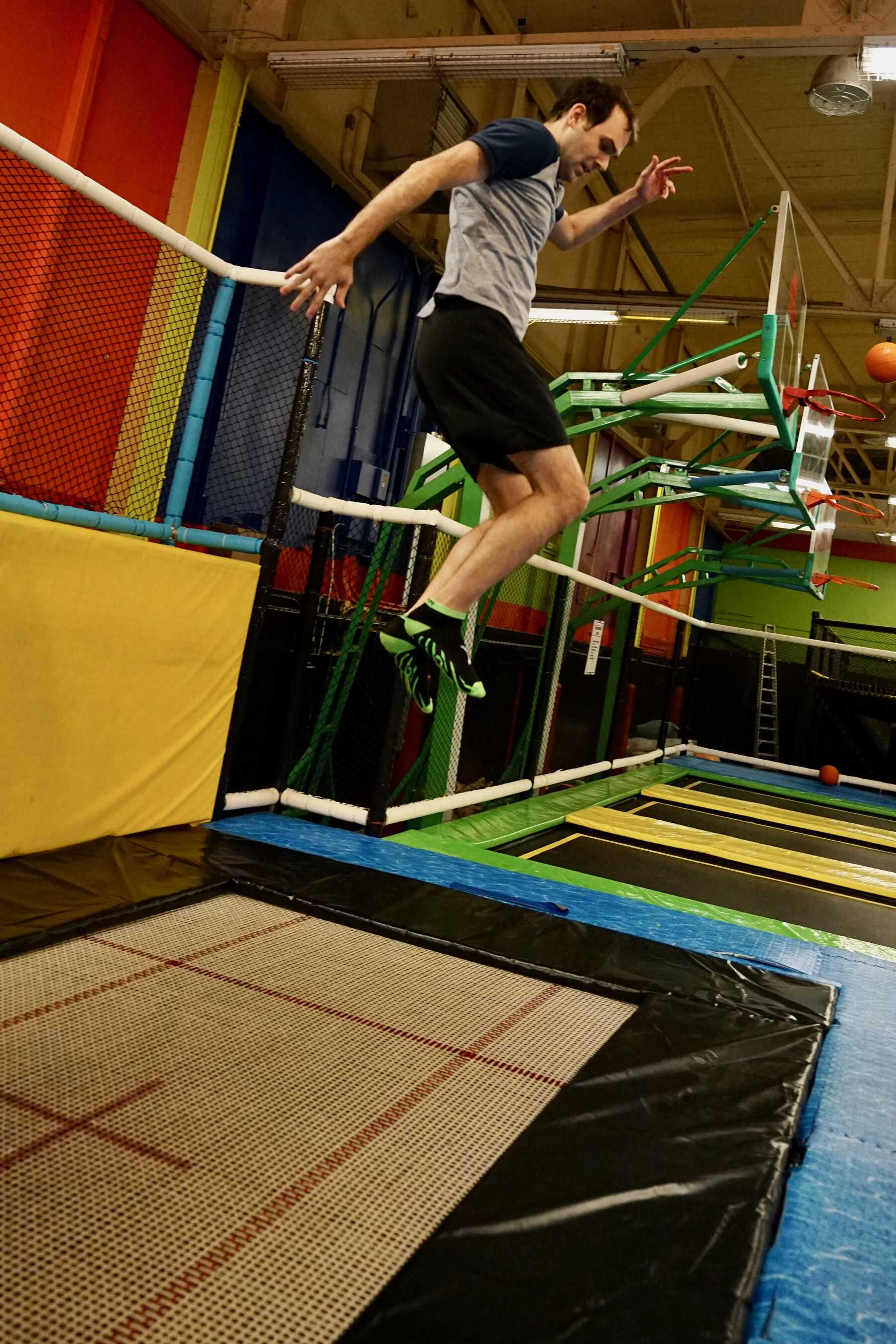 Man in mid jump on trampoline